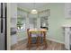 Eat-in kitchen with wood-look floors and corner window at 1020 Hilltop Rd, Tavares, FL 32778