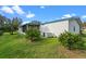 Single-story home with a well-maintained lawn at 1020 Hilltop Rd, Tavares, FL 32778