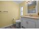 Clean bathroom with a single sink vanity and shower/tub combo at 1020 Hilltop Rd, Tavares, FL 32778