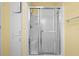 Clean shower with sliding glass doors and tiled walls at 1020 Hilltop Rd, Tavares, FL 32778