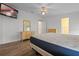 Main bedroom with wood-look floors and a queen bed at 1020 Hilltop Rd, Tavares, FL 32778