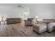 Open living room with seating area and access to dining area at 1020 Hilltop Rd, Tavares, FL 32778