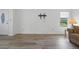 Living room with wood-look floors and a view of the front yard at 1020 Hilltop Rd, Tavares, FL 32778