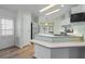 Kitchen with stainless steel appliances and ample counter space at 1020 Hilltop Rd, Tavares, FL 32778