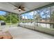 Spacious screened porch overlooking a tranquil pond at 1020 Hilltop Rd, Tavares, FL 32778