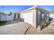 Home exterior with attached garage and landscaping at 547 Richburg St, The Villages, FL 32162
