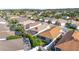 Aerial view of a single-Gathering home with a backyard patio and surrounding neighborhood at 547 Richburg St, The Villages, FL 32162