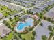 Aerial view of community pool and surrounding neighborhood at 2105 Lula Rd, Minneola, FL 34715