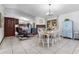 Bright dining area with a table, chairs, and a view into the kitchen at 307 Water Shore Dr, Leesburg, FL 34748