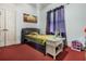 Cozy bedroom with double bed, nightstand, and large window at 919 Patrick St, Kissimmee, FL 34741