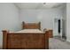 Bedroom with wood frame bed and carpet at 919 Patrick St, Kissimmee, FL 34741