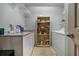 Laundry room with washer, dryer, shelving, and counter space at 919 Patrick St, Kissimmee, FL 34741