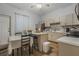 Modern kitchen with light cabinets, island, and breakfast nook at 919 Patrick St, Kissimmee, FL 34741