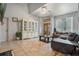 Spacious living room with leather sofas, tiled floors, and a large cabinet at 919 Patrick St, Kissimmee, FL 34741