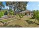 Large backyard with garden and screened patio at 919 Patrick St, Kissimmee, FL 34741