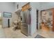 Kitchen features stainless steel refrigerator and pantry access at 919 Patrick St, Kissimmee, FL 34741