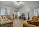 Spacious living room with wood-look floors and comfy sofas at 919 Patrick St, Kissimmee, FL 34741