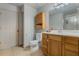 Clean bathroom with toilet, vanity, and shower at 919 Patrick St, Kissimmee, FL 34741