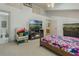 Primary bedroom with a large bed, TV, and fireplace at 919 Patrick St, Kissimmee, FL 34741