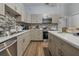 Modern kitchen with stainless steel appliances and stylish backsplash at 919 Patrick St, Kissimmee, FL 34741