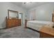 Bright bedroom with wood dresser and carpet at 919 Patrick St, Kissimmee, FL 34741
