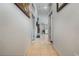 Long hallway with tile floors and access to bedrooms at 919 Patrick St, Kissimmee, FL 34741