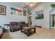 Living room with two leather sofas, coffee table, and wall-mounted TV at 919 Patrick St, Kissimmee, FL 34741