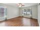 Spacious bedroom with wood-look floors and large windows at 34321 Shadewood Cir, Leesburg, FL 34788