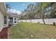 Large backyard with grassy area and privacy fence at 34321 Shadewood Cir, Leesburg, FL 34788