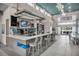 Modern community kitchen with bar seating and stainless steel appliances at 7740 Sandy Ridge Dr # 106, Reunion, FL 34747