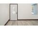 White door with an oval glass window at 3610 Se 131St Ln, Belleview, FL 34420