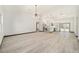 Open concept living area with modern light fixture at 3610 Se 131St Ln, Belleview, FL 34420