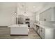Modern kitchen with white cabinets, quartz countertops, and an island at 3610 Se 131St Ln, Belleview, FL 34420
