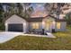 Newly constructed one-story home with a two-car garage at 3610 Se 131St Ln, Belleview, FL 34420