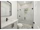 Modern bathroom with walk-in shower and grey tile at 3610 Se 131St Ln, Belleview, FL 34420