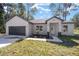 Newly constructed one-story home with a two-car garage at 3610 Se 131St Ln, Belleview, FL 34420