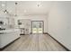 Modern kitchen with white cabinets, quartz countertops, and stainless steel appliances at 3610 Se 131St Ln, Belleview, FL 34420