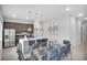 Kitchen with dining area and glass table with gray chairs at 7740 Sandy Ridge Dr # 106, Reunion, FL 34747