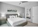 King-size bed, large window, and modern decor in this bedroom at 7740 Sandy Ridge Dr # 106, Reunion, FL 34747