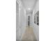 Bright hallway with light grey walls and concrete flooring at 7740 Sandy Ridge Dr # 106, Reunion, FL 34747