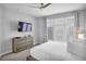 Spacious primary bedroom with large windows and dresser at 7740 Sandy Ridge Dr # 106, Reunion, FL 34747