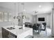 Modern kitchen with island, stainless steel appliances, and quartz counters at 7740 Sandy Ridge Dr # 106, Reunion, FL 34747