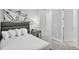 Bright bedroom with a comfortable queen-size bed and modern decor at 7740 Sandy Ridge Dr # 106, Reunion, FL 34747