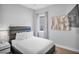 Guest bedroom with full bed, window, and tasteful decor at 7740 Sandy Ridge Dr # 106, Reunion, FL 34747