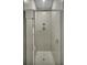 Walk-in shower with neutral tile and glass enclosure at 7740 Sandy Ridge Dr # 106, Reunion, FL 34747