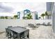 Outdoor patio with dining table and comfortable seating at 7740 Sandy Ridge Dr # 106, Reunion, FL 34747