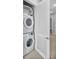 Convenient laundry room with stackable washer and dryer at 7740 Sandy Ridge Dr # 106, Reunion, FL 34747