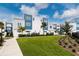 Modern townhouses with a beautifully landscaped lawn at 7740 Sandy Ridge Dr # 106, Reunion, FL 34747