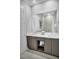 Double vanity bathroom with modern gray cabinets at 7740 Sandy Ridge Dr # 106, Reunion, FL 34747