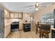 Eat-in kitchen with stainless steel appliances and wood-look flooring at 212 Rue De Pont, Tavares, FL 32778